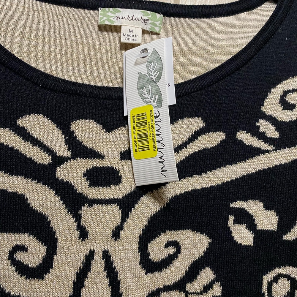 Nurture women’s sweater new with tags size, medium, black with gold designs